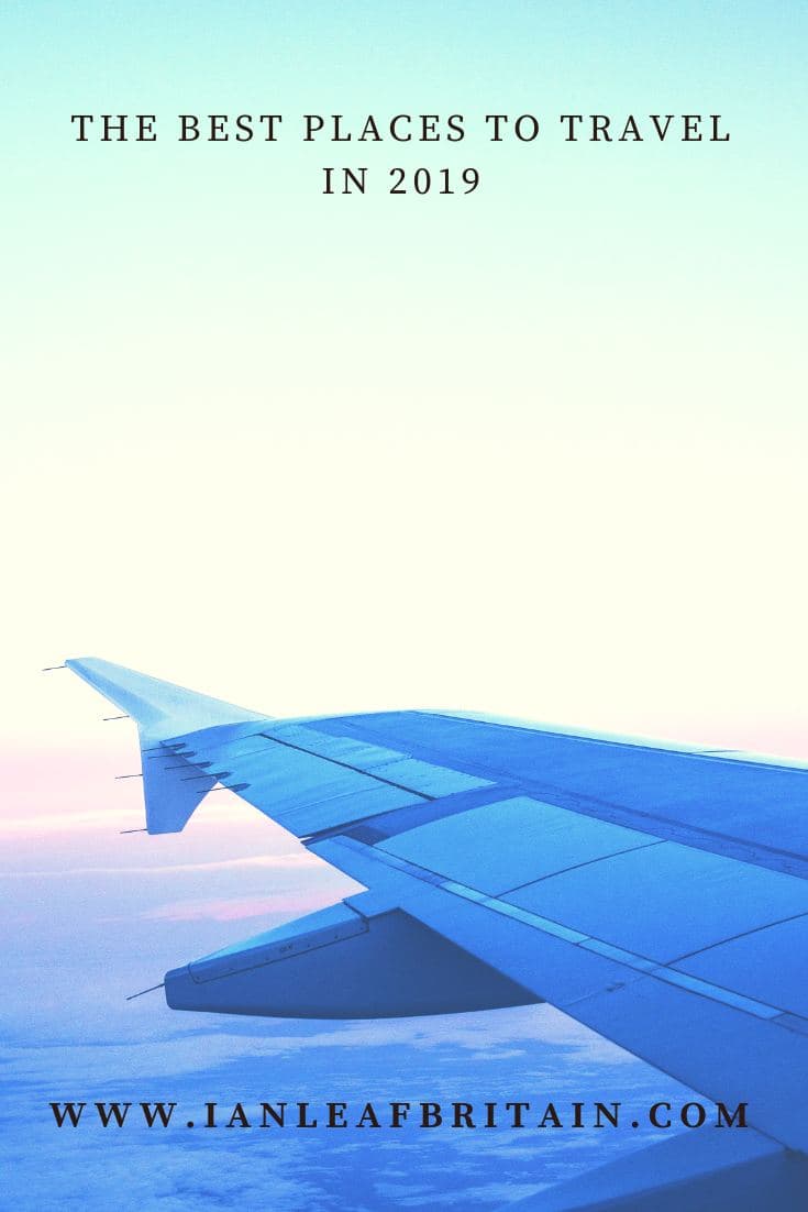 Airplane wing over clouds, with the headline 'The Best Places to Travel in 2019'